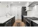 Contemporary kitchen featuring sleek cabinetry, stainless steel appliances, and a subway tile backsplash at 1250 W Osceola St # 2, Denver, CO 80204