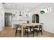 Bright kitchen with stainless steel appliances, white countertops, and an island with barstool seating at 1250 W Osceola St # 2, Denver, CO 80204