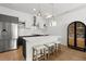Modern kitchen with stainless steel appliances, white countertops, and a large island with seating at 1250 W Osceola St # 2, Denver, CO 80204