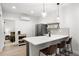 Sleek kitchen featuring a breakfast bar, pendant lighting, and stainless steel appliances at 1250 W Osceola St # 2, Denver, CO 80204