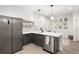 Well-lit kitchen with modern cabinetry, stainless steel appliances, and stylish backsplash at 1250 W Osceola St # 2, Denver, CO 80204
