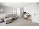 Bright living room with desk, sofa, and neutral carpet at 1250 W Osceola St # 2, Denver, CO 80204