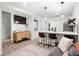 Open living room with a modern kitchen, comfortable seating, and stylish decor at 1250 W Osceola St # 2, Denver, CO 80204