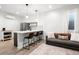 Inviting living room featuring a breakfast bar, comfortable seating, and modern decor at 1250 W Osceola St # 2, Denver, CO 80204