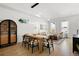 Open-concept living space with hardwood floors, comfortable seating, and a dining area at 1250 W Osceola St # 2, Denver, CO 80204