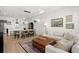 Bright, open-concept living and dining area with hardwood floors and stylish decor at 1250 W Osceola St # 2, Denver, CO 80204