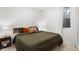 Comfortable main bedroom with a large bed, natural light, and minimalist decor at 1250 W Osceola St # 2, Denver, CO 80204