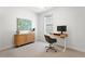 Bright home office featuring a modern desk, a decorative cabinet and neutral carpet at 1250 W Osceola St # 2, Denver, CO 80204