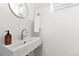 Elegant powder room with modern sink and mirror at 1250 W Osceola St # 2, Denver, CO 80204