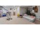 View of unfinished basement space, including exercise equipment, storage, and ample open floor area at 2246 S Ensenada St, Aurora, CO 80013