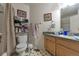 Functional bathroom featuring a shower, toilet, and vanity with a sink at 2246 S Ensenada St, Aurora, CO 80013