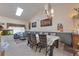 Bright dining area with vaulted ceiling and a skylight, complemented by art and an aquarium at 2246 S Ensenada St, Aurora, CO 80013