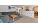 Comfortable living area with a gray sofa and a view into the adjoining kitchen and dining spaces at 2246 S Ensenada St, Aurora, CO 80013
