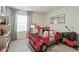 Fun bedroom with a unique firetruck bed, perfect for a imagination and playful dreams at 4732 Windmill Dr, Brighton, CO 80601