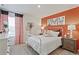 Charming bedroom features a comfy bed, decorative accents, and warm tones for a cozy and inviting feel at 4732 Windmill Dr, Brighton, CO 80601