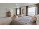 Comfortable bedroom with two chairs, soft carpet, and warm lighting creates a peaceful and inviting space at 4732 Windmill Dr, Brighton, CO 80601