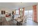 Open concept dining area and living room, perfect for modern living and entertaining at 4732 Windmill Dr, Brighton, CO 80601