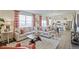 Bright living room with stylish furnishings, an open layout, and plenty of natural light at 4732 Windmill Dr, Brighton, CO 80601