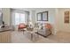 Cozy living room features a comfortable gray sofa, decorative pillows, and stylish accents for a welcoming space at 4732 Windmill Dr, Brighton, CO 80601