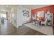 Bright home office with stylish decor, a wooden desk, and cozy seating area at 4732 Windmill Dr, Brighton, CO 80601