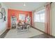 Bright home office with stylish decor, a wooden desk, and cozy seating area at 4732 Windmill Dr, Brighton, CO 80601