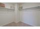 Empty walk-in closet providing ample storage space with shelves and rods, ready for personalization at 4732 Windmill Dr, Brighton, CO 80601
