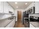 Modern kitchen with stainless steel appliances at 8745 Yukon St # 30, Arvada, CO 80005