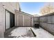 Private patio with storage shed and snow at 8745 Yukon St # 30, Arvada, CO 80005