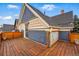 Exterior view of back deck showing decorative tiles and blue siding at 91 S Sherman St, Denver, CO 80209