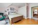 Cozy bedroom with hardwood floors, neutral paint, and a custom closet unit at 91 S Sherman St, Denver, CO 80209