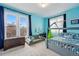 Bright bedroom with a sitting area, and ample natural light from large windows at 91 S Sherman St, Denver, CO 80209