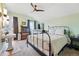 A nicely lit bedroom featuring a ceiling fan and a metal bed frame at 91 S Sherman St, Denver, CO 80209