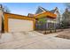 Captivating home exterior boasting a spacious garage and a second-story wooden deck for outdoor relaxation at 91 S Sherman St, Denver, CO 80209