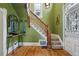 Entryway featuring wood floors, staircase, decorative mirror, and glass paneled door at 91 S Sherman St, Denver, CO 80209