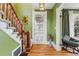 Inviting entry with staircase and stylish decor adjacent to a cozy living space at 91 S Sherman St, Denver, CO 80209