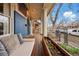 Inviting front porch with a porch swing, planter box, and view of the street at 91 S Sherman St, Denver, CO 80209