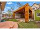 Open garage with wooden beams and lots of storage space and work area at 91 S Sherman St, Denver, CO 80209