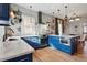Bright, spacious kitchen features blue cabinetry, stainless appliances, and a large island at 91 S Sherman St, Denver, CO 80209