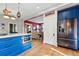 Bright kitchen with a view to the adjacent living area, stainless steel appliances, and center island at 91 S Sherman St, Denver, CO 80209