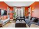 Bright living room featuring a large sectional sofa, hardwood floors, and a modern entertainment center at 91 S Sherman St, Denver, CO 80209