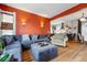 Comfortable living room featuring a gray sectional sofa and an open layout to the kitchen at 91 S Sherman St, Denver, CO 80209