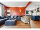 Comfortable living room with an open layout, hardwood floors, an expansive sectional, and kitchen access at 91 S Sherman St, Denver, CO 80209