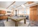 Spacious game room with a beautiful pool table, unique tile flooring, and ample lighting at 760 Dean Dr, Northglenn, CO 80233
