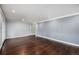 Bright and open living area with hardwood floors, crown molding, and ample space for entertaining at 760 Dean Dr, Northglenn, CO 80233
