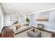 Bright living room with comfortable seating, tasteful decor, and a light and airy ambiance at 760 Dean Dr, Northglenn, CO 80233