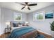 Serene bedroom with a ceiling fan, ample natural light, and cozy decor at 760 Dean Dr, Northglenn, CO 80233