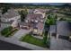 Lovely aerial view of a blue home with a manicured lawn and stone detailing in an attractive neighborhood at 1176 Dales Pony Dr, Castle Rock, CO 80104