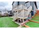 Backyard with a deck, hot tub, and artificial turf, perfect for outdoor enjoyment and low maintenance at 1176 Dales Pony Dr, Castle Rock, CO 80104