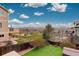 Expansive backyard view featuring manicured lawn, landscaping, and stunning mountain views beyond at 1176 Dales Pony Dr, Castle Rock, CO 80104