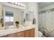 Bright bathroom featuring double sinks, granite countertops, and a separate shower room at 1176 Dales Pony Dr, Castle Rock, CO 80104